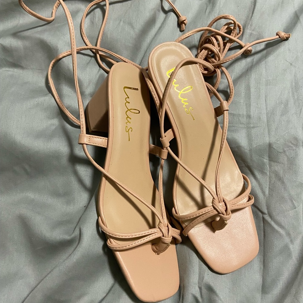Lulul’s nude/light pink lace up heels.